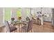 Dining room with a modern table and chairs next to a kitchen at 603 River Gardens Se Dr, Atlanta, GA 30354