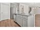 Open-concept kitchen island with stainless steel dishwasher and eat-in breakfast bar at 603 River Gardens Se Dr, Atlanta, GA 30354