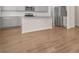 Kitchen with gray cabinets, stainless appliances, granite counters, and wood-look flooring at 603 River Gardens Se Dr, Atlanta, GA 30354