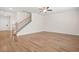 Spacious living area with wood-look floors, a staircase, and a bright, airy atmosphere at 603 River Gardens Se Dr, Atlanta, GA 30354