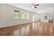 Open-concept living space with wood-look floors, many windows, and view of the kitchen at 603 River Gardens Se Dr, Atlanta, GA 30354