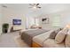 Bright main bedroom with large bed, TV, and serene decor at 603 River Gardens Se Dr, Atlanta, GA 30354
