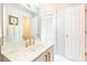 Well-lit bathroom with a white vanity, gold hardware, a large mirror, and access to a closet at 824 Greenwood Ne Ave # 9, Atlanta, GA 30306