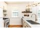 Bright kitchen with stainless steel appliances, marble countertop, and hardwood floors at 824 Greenwood Ne Ave # 9, Atlanta, GA 30306