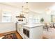 Open concept kitchen with a marble island, modern appliances, and stylish lighting at 824 Greenwood Ne Ave # 9, Atlanta, GA 30306