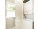 Laundry area featuring stacked washer and dryer and a window with natural light at 824 Greenwood Ne Ave # 9, Atlanta, GA 30306
