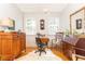Bright office space featuring hardwood floors, vintage furnishings, and natural light from two windows at 824 Greenwood Ne Ave # 9, Atlanta, GA 30306