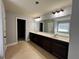 Spacious bathroom featuring double vanity, large mirror, and a separate tub at 3522 Fallen Oak Dr, Buford, GA 30519