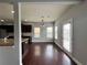 Dining area with hardwood floors, stylish lighting, and access to the backyard at 3522 Fallen Oak Dr, Buford, GA 30519