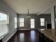 Open dining area with bright windows and access to the living room at 3522 Fallen Oak Dr, Buford, GA 30519