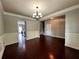 Open dining area with hardwood floors and classic wainscoting provides an elegant touch at 3522 Fallen Oak Dr, Buford, GA 30519