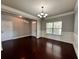 Bright dining room featuring hardwood floors, a modern chandelier, and neutral paint at 3522 Fallen Oak Dr, Buford, GA 30519