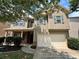 Inviting two-story home features a two-car garage, neutral siding, and charming curb appeal at 3522 Fallen Oak Dr, Buford, GA 30519