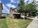 Charming home with a well-manicured lawn and professional real estate sign at 3522 Fallen Oak Dr, Buford, GA 30519