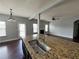 Open concept kitchen island with granite countertop and sink at 3522 Fallen Oak Dr, Buford, GA 30519