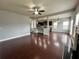 Open living space with dark wood floors and kitchen view at 3522 Fallen Oak Dr, Buford, GA 30519