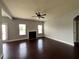 Spacious living room with fireplace, hardwood floors, and abundant natural light at 3522 Fallen Oak Dr, Buford, GA 30519