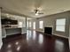 Spacious living room with a fireplace and dark hardwood floors at 3522 Fallen Oak Dr, Buford, GA 30519