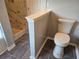 Contemporary bathroom with stylish grey tile flooring, modern toilet, and glass shower, offering a sleek and functional design at 4284 Caroline Ct, Douglasville, GA 30135