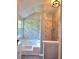 Luxurious bathroom with marble-like tiling, a soaking tub, and separate glass-enclosed shower for a serene, spa-like experience at 4284 Caroline Ct, Douglasville, GA 30135