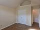 Neutral-toned bedroom featuring wood flooring, closet and doors at 4284 Caroline Ct, Douglasville, GA 30135