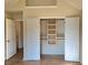 Large walk-in closet with custom shelving and organization system at 4284 Caroline Ct, Douglasville, GA 30135