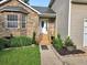 Charming home entrance with stone accents, a welcoming porch, and tidy landscaping at 4284 Caroline Ct, Douglasville, GA 30135