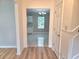 Hallway with views into the kitchen and dining area with modern flooring and fixtures at 4284 Caroline Ct, Douglasville, GA 30135
