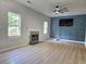 Bright living room boasting high ceilings, a fireplace, and modern ceiling fan at 4284 Caroline Ct, Douglasville, GA 30135