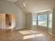 Spacious living room with new flooring, high ceilings, and large windows for natural light at 4284 Caroline Ct, Douglasville, GA 30135
