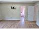 Spacious main bedroom showcasing hardwood floors, neutral walls, with doors to other spaces and a TV mount at 4284 Caroline Ct, Douglasville, GA 30135