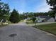 A quiet street featuring well-manicured lawns and various single-Gathering homes at 4284 Caroline Ct, Douglasville, GA 30135