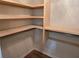 Walk-in closet with custom wood shelving and hanging rods providing ample storage solutions, maximizing organization at 4284 Caroline Ct, Douglasville, GA 30135