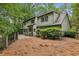 Landscaped backyard with black iron fence, patio and mature trees offering privacy and outdoor enjoyment at 6100 Blackwater Trl, Atlanta, GA 30328