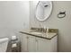 Cozy bathroom featuring granite countertop on vanity with a large mirror and toilet at 6100 Blackwater Trl, Atlanta, GA 30328