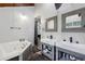 Bright bathroom with a soaking tub, double sinks, and modern fixtures at 6100 Blackwater Trl, Atlanta, GA 30328