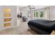 Comfortable bedroom with large windows, a chair, and neutral carpet at 6100 Blackwater Trl, Atlanta, GA 30328
