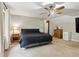 Comfortable bedroom with a ceiling fan, large window, and neutral carpet at 6100 Blackwater Trl, Atlanta, GA 30328