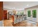 Modern kitchen with stainless steel appliances, bar seating, and access to the outdoor patio at 6100 Blackwater Trl, Atlanta, GA 30328