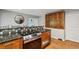 Modern kitchen with wood cabinets, stainless steel appliances, and an eat-in bar area at 6100 Blackwater Trl, Atlanta, GA 30328