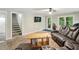 Relaxing living area with a large sofa, stairs and multiple windows for natural light at 6100 Blackwater Trl, Atlanta, GA 30328