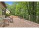 Paver patio offering an outdoor seating area and views of the beautifully wooded surroundings at 6100 Blackwater Trl, Atlanta, GA 30328