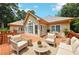 Back deck area with comfortable outdoor furniture, perfect for entertaining guests at 8110 Lakemont Close, Mcdonough, GA 30253