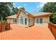 Spacious back deck featuring views of the home and surrounding trees at 8110 Lakemont Close, Mcdonough, GA 30253