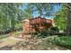 Spacious backyard with multi-level deck, mature trees, garden area, and plenty of space to play at 8110 Lakemont Close, Mcdonough, GA 30253