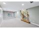 Finished basement with plush carpeting, natural light, and easy access to the upper levels at 8110 Lakemont Close, Mcdonough, GA 30253