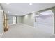 Finished basement features large open area with carpet and stairs to the upper floor at 8110 Lakemont Close, Mcdonough, GA 30253