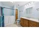 Well-lit bathroom with a walk-in tub, vanity with storage, and neutral walls at 8110 Lakemont Close, Mcdonough, GA 30253