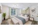 Cozy bedroom with neutral decor, decorative pillows, and abundant natural light at 8110 Lakemont Close, Mcdonough, GA 30253