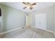 Neutral bedroom with carpet, ceiling fan and closet with double doors at 8110 Lakemont Close, Mcdonough, GA 30253